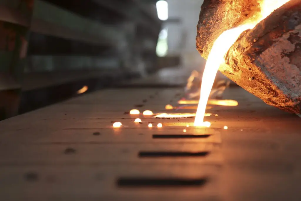 Ferrous metal being casted