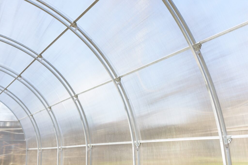 Clear polycarbonate plastic in greenhouse